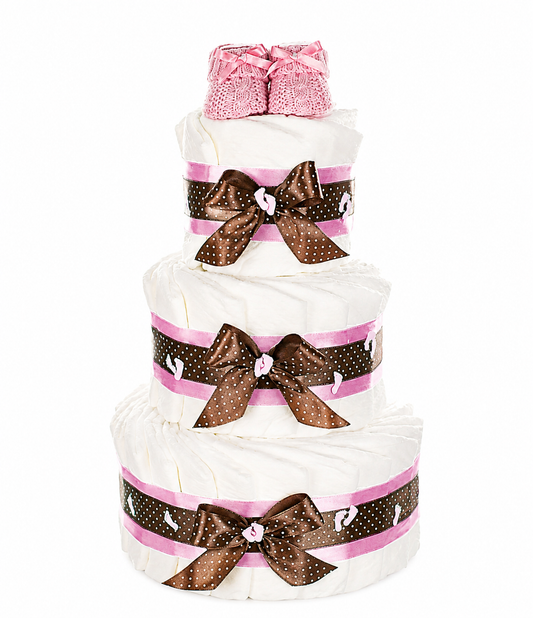 Three-tier diaper cake made of white diapers with pink baby booties and brown polka-dot bows
