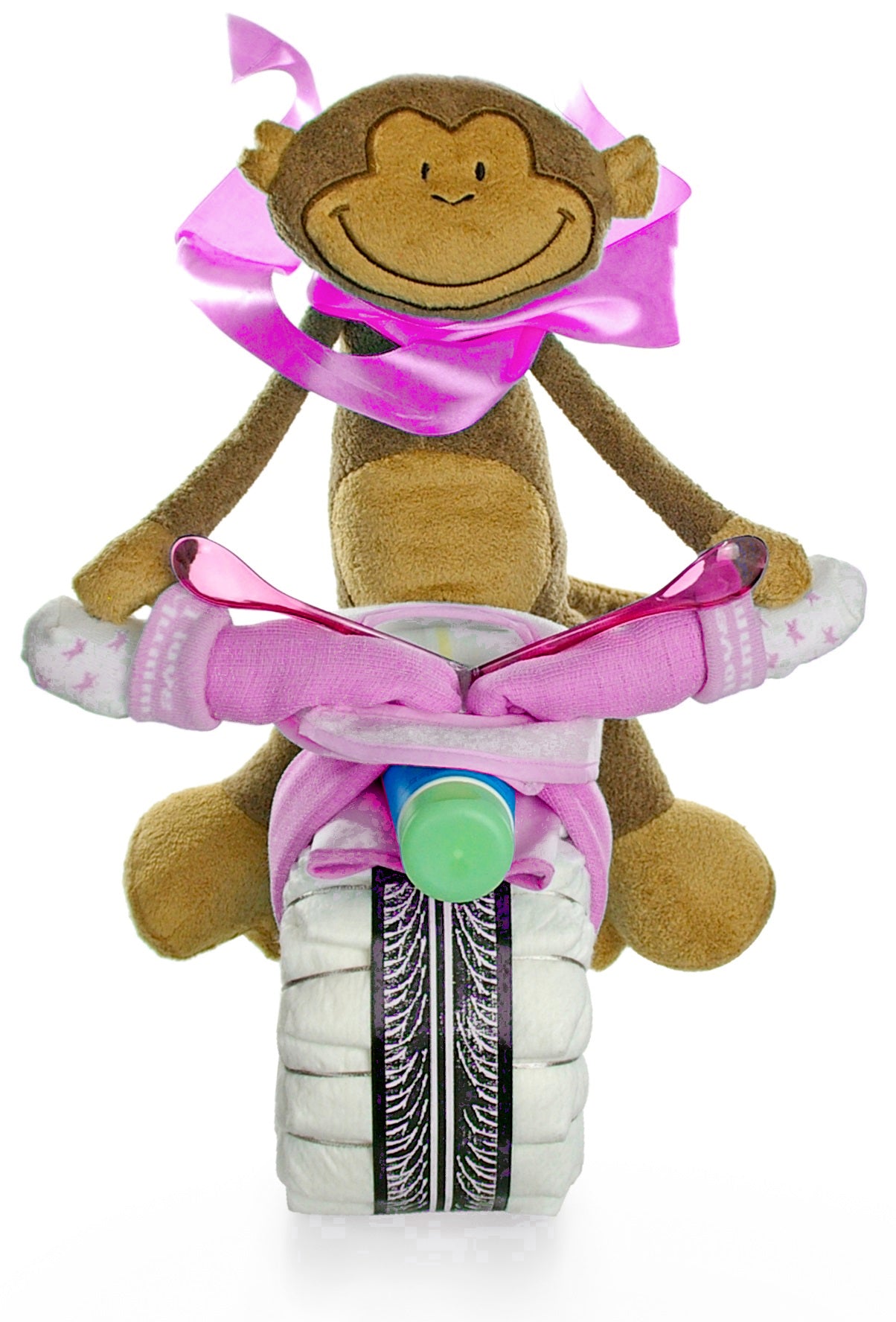 Front view of floppy monkey on a pink diaper motorcycle with sock handlebars, spoons and pacifier strap