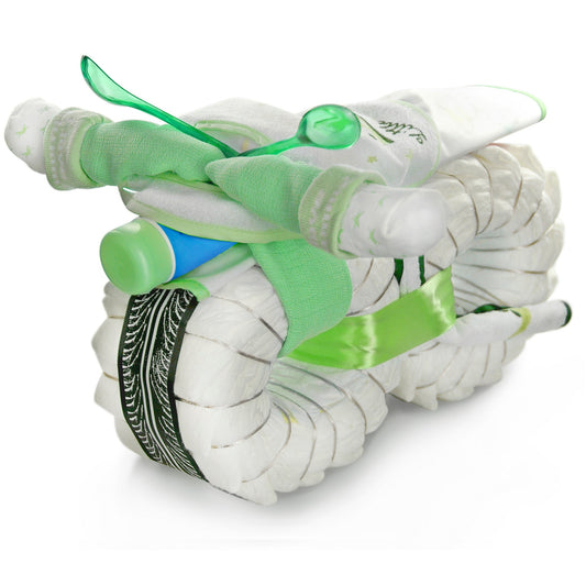 Green diaper motorcycle made from rolled diapers, socks, bibs, a baby bottle and two baby spoons