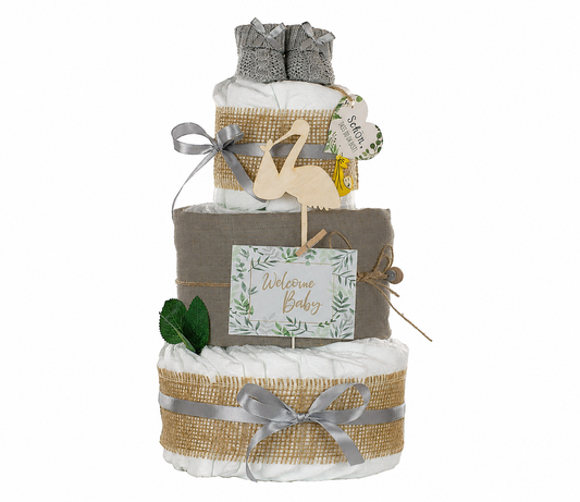 Grey diaper cake on white with wooden stork, baby booties, muslin cloth and Welcome Baby card