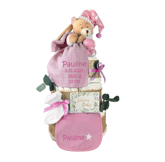 Cut-out pink diaper cake with musical teddy, “Pauline” muslin cloth, bib, baby socks and card.