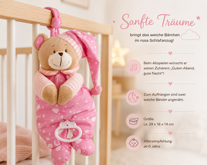 Rosa Spieluhr-Teddybär im Schlafanzug am Babybett; daneben Größe 29 × 16 × 14 cm und Alter ab 0 Jahren.